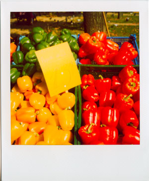 Green, red, and yellow peppers at a farmers' market in Frankfurt, Germany